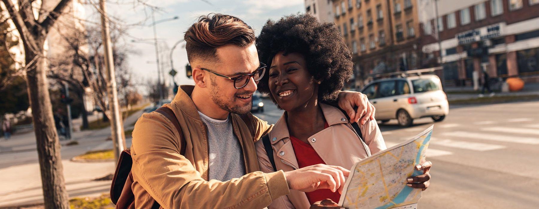 a man and woman looking at a map